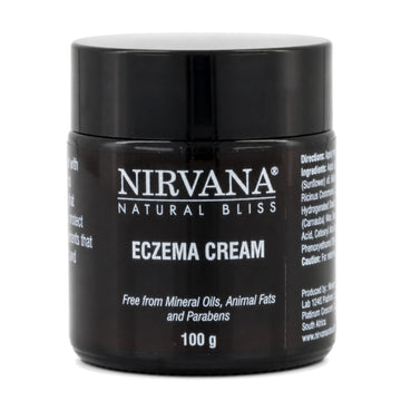 A brown glass  jar of Nirvana Natural Bliss Eczema Cream, 100g, on a plain white background.