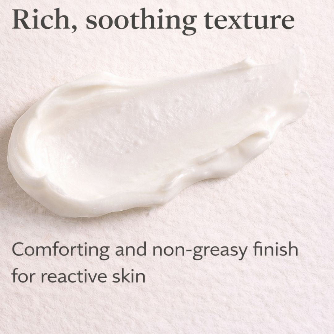 White cream smear on a light background with text about texture and finish for reactive skin.